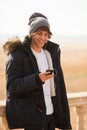 Young handsome man consulting phone outdoors Royalty Free Stock Photo