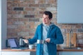 Young handsome man cooking at kitchen Royalty Free Stock Photo