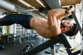 Young handsome man doing exercise for abdominal muscles Royalty Free Stock Photo