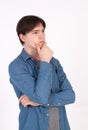 Young handsome man doubting isolated over gray background Royalty Free Stock Photo
