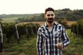Young handsome man drinking wine in vineyard Royalty Free Stock Photo