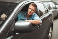 Young handsome man driving his car looking nervous stuck in traffic jam Royalty Free Stock Photo