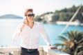 Young handsome man enjoying stay at luxury resort hotel with panoramic view on the sea Royalty Free Stock Photo