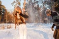 A young handsome man of European appearance and a young Asian girl in a park on the nature in winter Royalty Free Stock Photo