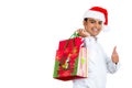 Young handsome man excited about christmas shopping Royalty Free Stock Photo
