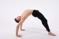 Young handsome man and exercises. Training and relaxation. Stretching and warm-up