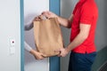 Man Giving Paper Bag To Woman Royalty Free Stock Photo