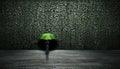 Young handsome man with green umbrella enjoying the rain and looking at the camera with copy space Royalty Free Stock Photo