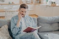 Young pensive handsome man finding new ideas and writing them down Royalty Free Stock Photo