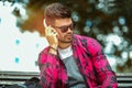 Young handsome man with headphones listening to music in a park Royalty Free Stock Photo