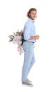 Young handsome man hiding beautiful flower bouquet behind his back