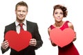 Young handsome man holding red heart and cheerful woman on white Royalty Free Stock Photo