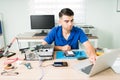 Young handsome man installing new software Royalty Free Stock Photo