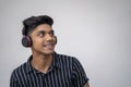 Young handsome man listening to music with headphones against white background Royalty Free Stock Photo