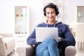 The young handsome man listening to music with headphones Royalty Free Stock Photo