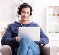 Young handsome man listening to music with headphones Royalty Free Stock Photo