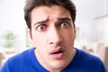 The young handsome man looking scared and surprised Royalty Free Stock Photo