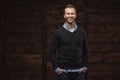 Young handsome man over wooden background Royalty Free Stock Photo