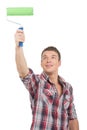 Young handsome man painting wall. Royalty Free Stock Photo