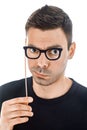 Young handsome man with paper glasses making faces Royalty Free Stock Photo