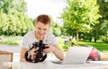 Attractive young man student using laptop outside Royalty Free Stock Photo