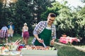 Handsome man preparing barbecue for friends Royalty Free Stock Photo