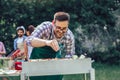 Handsome man preparing barbecue for friends Royalty Free Stock Photo