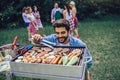 Handsome man preparing barbecue for friends Royalty Free Stock Photo