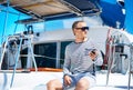 Young and handsome man on a sailing boat Royalty Free Stock Photo