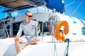 Young and handsome man on a sailing boat Royalty Free Stock Photo