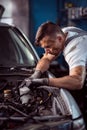 Young handsome man servicing vehicle Royalty Free Stock Photo
