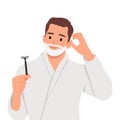 Young handsome man shaving his beard over isolated background having doubts and with confuse face expression Royalty Free Stock Photo