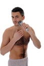 Young handsome man shaving in the morning Royalty Free Stock Photo