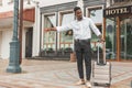 Young handsome man on side of a road, hailing and stopping a taxi cab Royalty Free Stock Photo