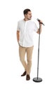 Young handsome man singing in microphone Royalty Free Stock Photo