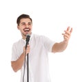 Young handsome man singing in microphone on white Royalty Free Stock Photo