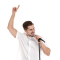 Young handsome man singing in microphone on white Royalty Free Stock Photo