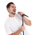 Young handsome man singing in microphone on white Royalty Free Stock Photo