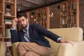 Young handsome man sitting sofa cafe Royalty Free Stock Photo