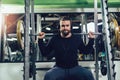 Handsome man in sportswear exercising at gym Royalty Free Stock Photo