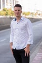 Young handsome man standing and waiting on the side of street Royalty Free Stock Photo