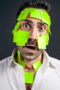 Young handsome man with sticky notes on his face Royalty Free Stock Photo