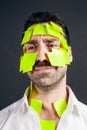 Young handsome man with sticky notes on his face Royalty Free Stock Photo