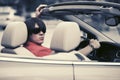 Young man in sunglasses driving convertible car Royalty Free Stock Photo