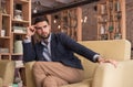 Young handsome man thinking looking cafe indoors Royalty Free Stock Photo