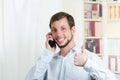 Young handsome man using cell phone Royalty Free Stock Photo