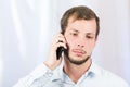 Young handsome man using cell phone Royalty Free Stock Photo