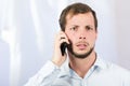 Young handsome man using cell phone Royalty Free Stock Photo