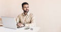 Young handsome man using laptop at home, Businessman or student working online on computer indoors Royalty Free Stock Photo