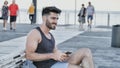 Young man using cell phone to send message Royalty Free Stock Photo